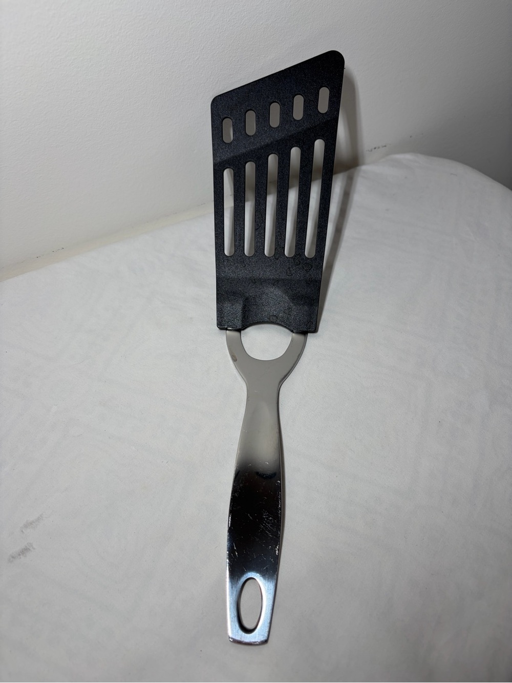 Oneida Black Nylon Slotted Turner Spatula with Stainless Steel Handle